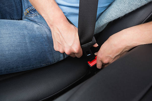 istock Woman putting on her seat belt 474653054