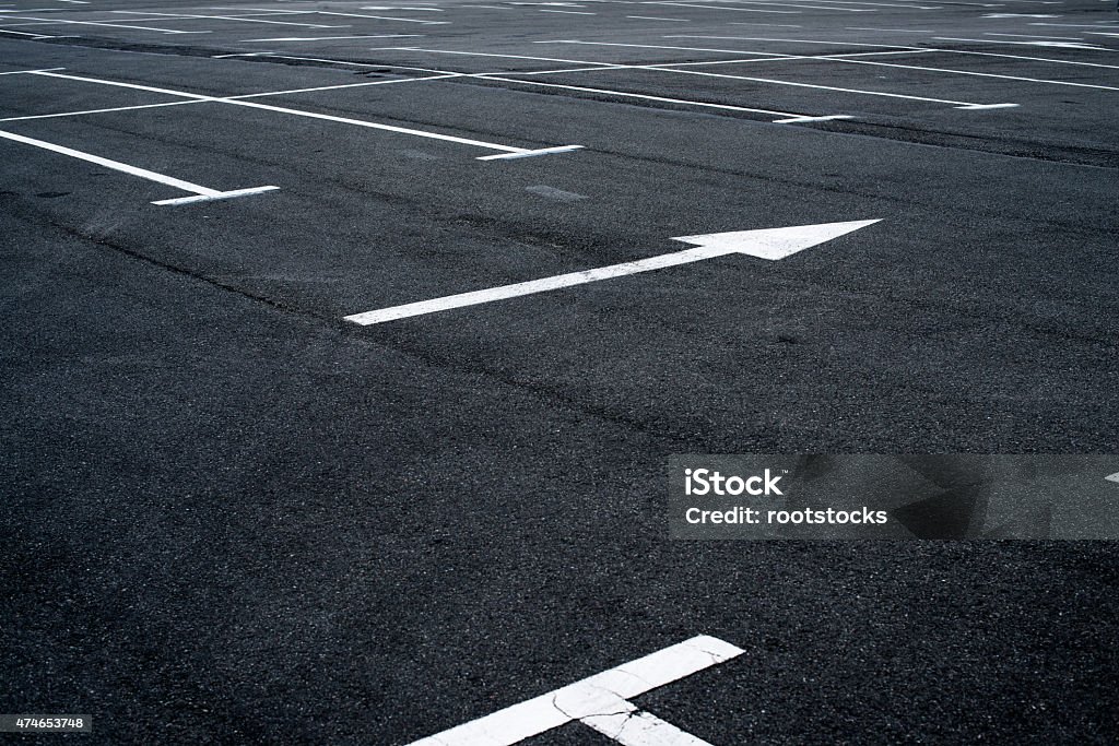 Asphalt surface of the parking with road marking lines Asphalt surface of the empty parking with white road marking lines 2015 Stock Photo