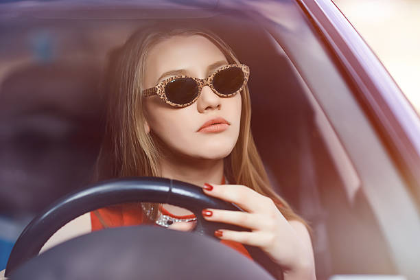 istock glam woman inside car 474654416