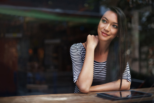 Shot of an attractive young woman at a coffee shophttp://195.154.178.81/DATA/i_collage/pu/shoots/804675.jpg