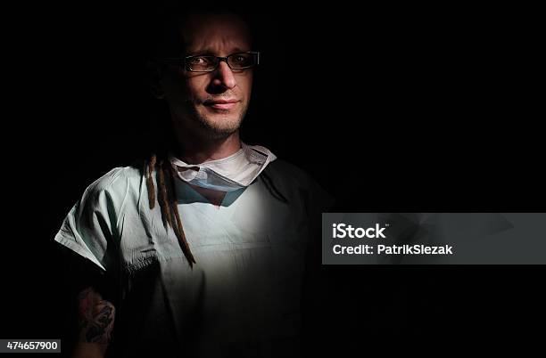 Portrait Of Male Nurse Icu With Tattoo And Dreadlocks Stock Photo - Download Image Now