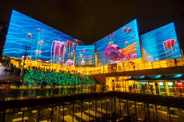 Sydney, Australia - May 22, 2015: A projection titled 'The Nautilus and the Sea' is seen on the facade of The Concourse, a performing arts centre located in Chatswood. Featuring jellyfish and colourful underwater scenes, it is being shown as part of the Vivid Sydney festival.