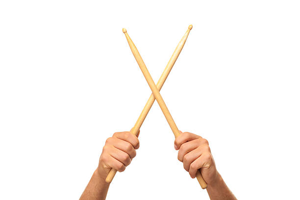 Male hands holding drum sticks Male hands holding drum sticks.isolated backgrund drummer hands stock pictures, royalty-free photos & images