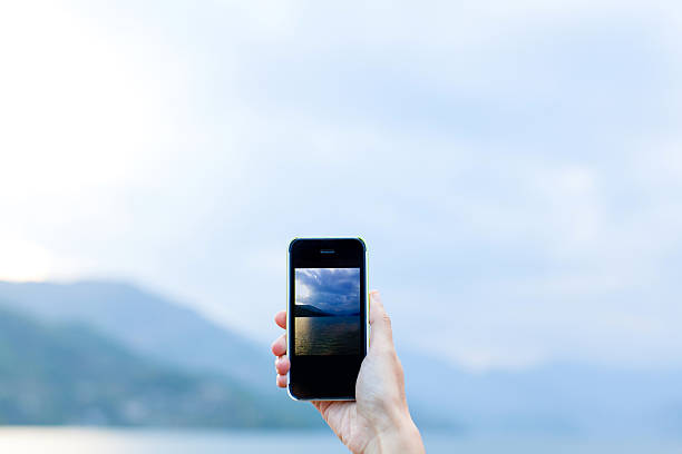 istock Hand taking photo landscape by smartphone 474667760