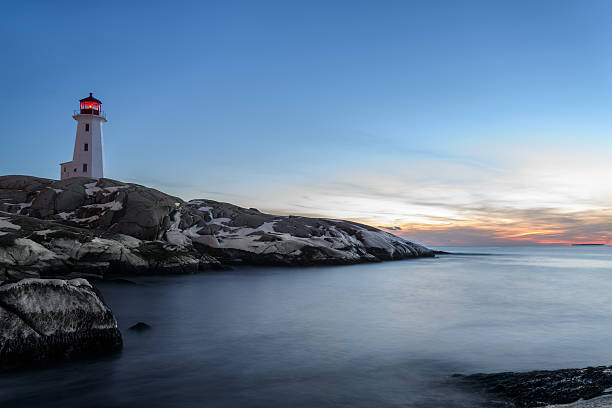 Peggys Cove's Lightouse at Dusk stock photo