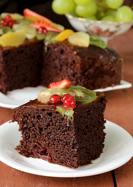 istock chocolate brownie cake decorated with different fruits 474671725