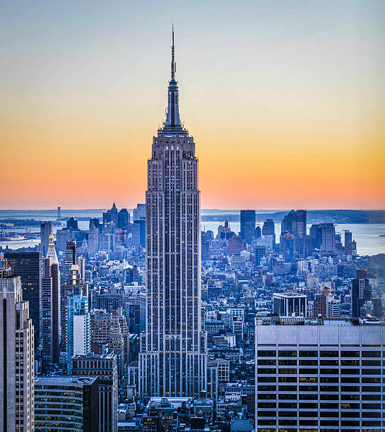 Newyork skyline Midttown New York with empire state in beautiful winter sunset. empire state building photos stock pictures, royalty-free photos & images