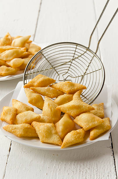 Fried Dumpling The fried dumpling is a typical Italian dish (from Emilia Romagna). This is fried bread dough. The fried dumpling can be accompanied with cold cuts and cheeses. deep fried photos stock pictures, royalty-free photos & images
