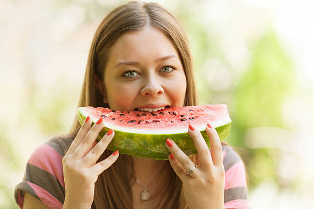 istock Girl eating watermelon 474675119