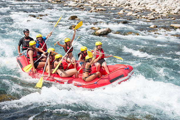 istock Group of people white water rafting 474676710