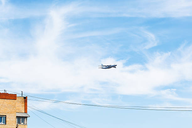 istock transport airplane over urban house 474687056