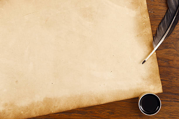 istock old paper on brown wood texture with feather and ink 474688096
