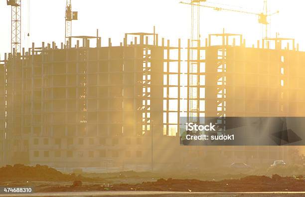 Construction Of A Large Building In The Sunset Stock Photo - Download Image Now - 2015, Architecture, Black Color