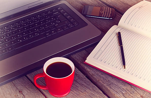 working desk with cup of coffee stock photo