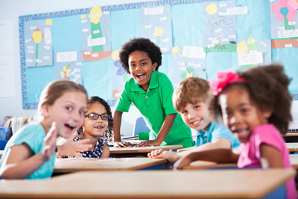 istock Group of children in classroom 474689935