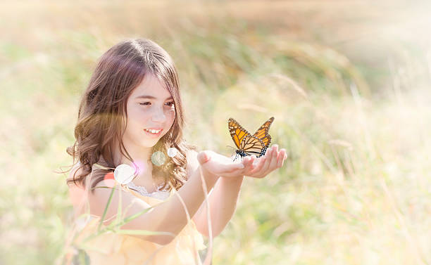 istock Girl Releasing a Butterfuly 474690135