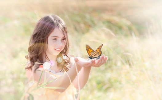Girl releasing a butterfly