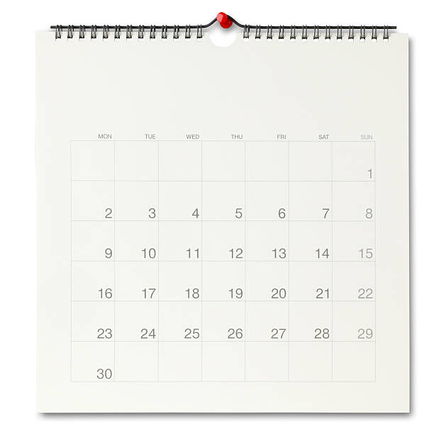 Wall calendar wall calendar page with a red push pin./isolated on white with clipping path wall calendar stock pictures, royalty-free photos & images