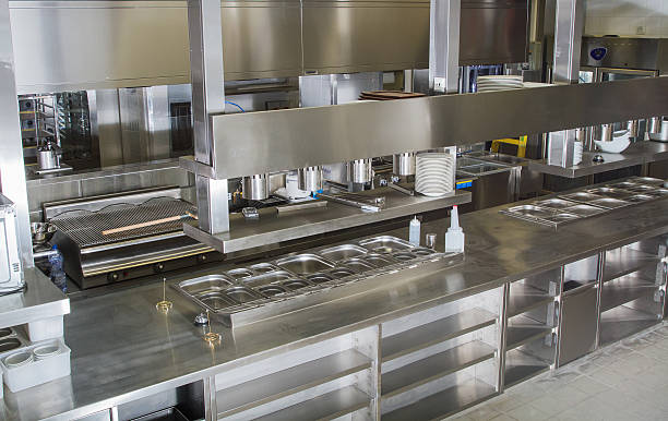 Professional kitchen , view counter in steel . Bokeh . stock photo