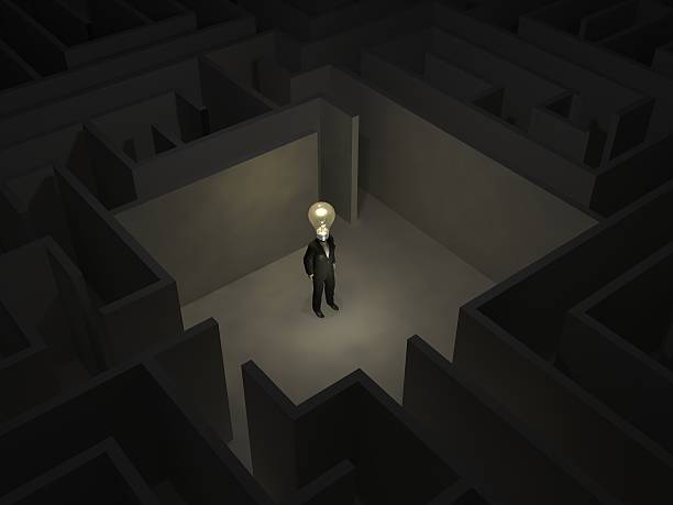 istock Man with a bulb in the middle of  maze 474693838