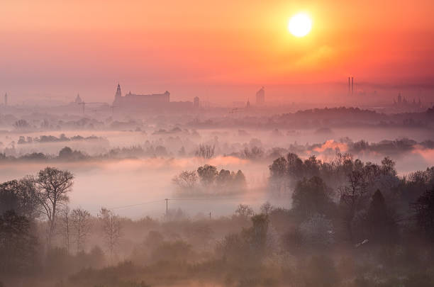 Vistula river valley and Krakow seen over the morning mists