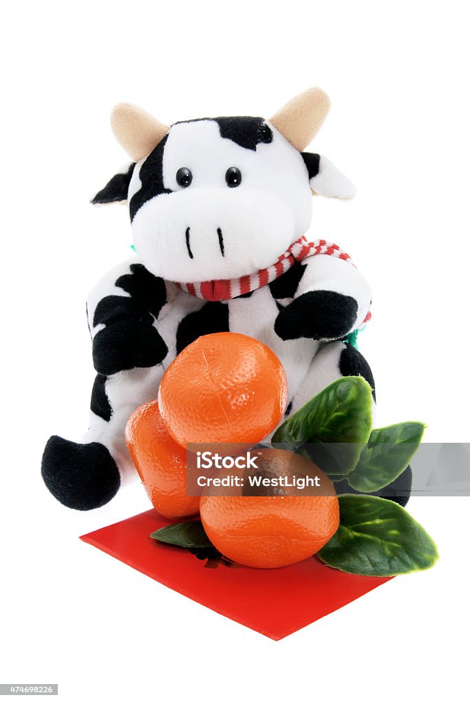 Soft Toy Cow and Tangerine Ornament Soft Toy Cow and Tangerine Ornament on White Background 2015 Stock Photo