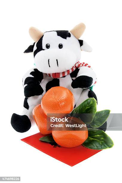 Soft Toy Cow And Tangerine Ornament Stock Photo - Download Image Now - 2015, Animal Hair, Celebration