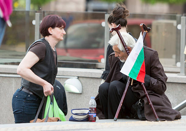 Homeless beggar Bulgarian flag Sofia, Bulgaria - May 15, 2015: A homeless beggar is begging at a subway underpass entrance in the center of Sofia. Years after joining the EU Bulgaria is still struggling with increasing poverty among its population. bulgarian culture stock pictures, royalty-free photos & images