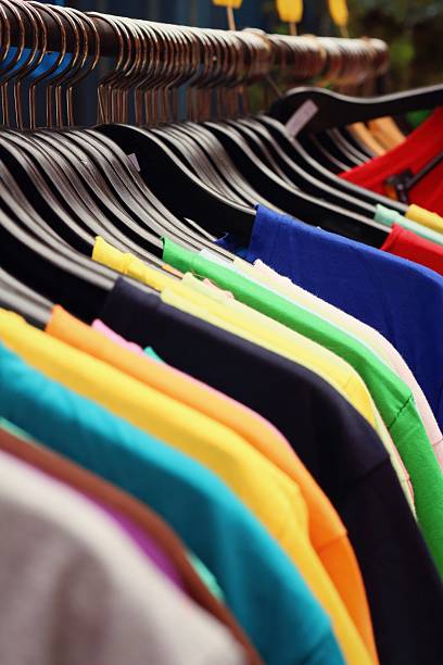 istock Shop shirts colorful fabric hanging on a rack. 474700142
