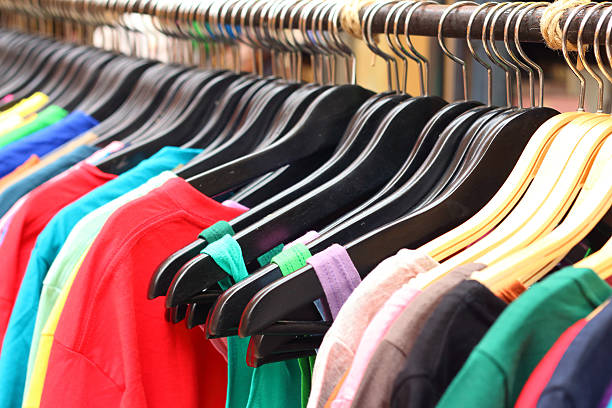 istock Shop shirts colorful fabric hanging on a rack. 474700144