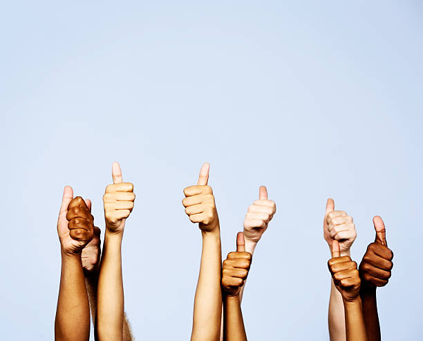 istock Three trios of hands giving thumbs-up signals 474702063