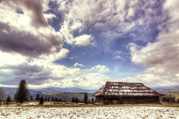 istock Old wooden house in the bright sky Carpathian 474704281