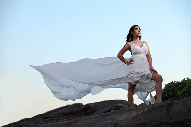 istock Young woman in white 474704381
