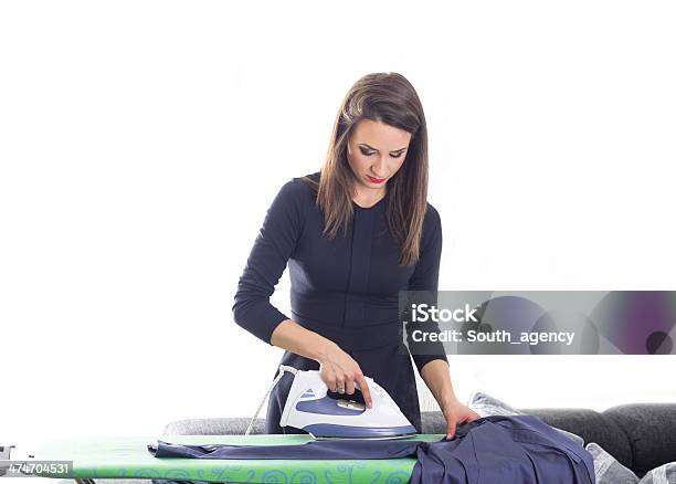 Happy Young Beautiful Woman Ironing Clothes Stock Photo - Download Image Now - Adult, Adults Only, Beautiful People