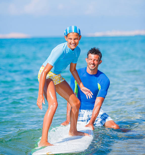 istock Girl with surf 474704694
