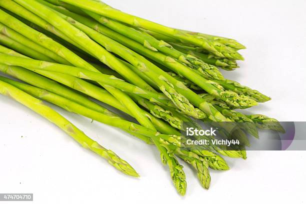 Green Asparagus Isolated On White Background Stock Photo - Download Image Now - 2015, Agriculture, Asian and Indian Ethnicities