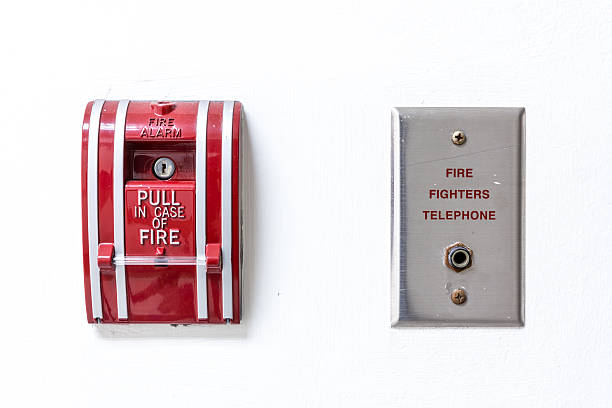 istock Fire alarm and telephone jack panel on white wall 474705750