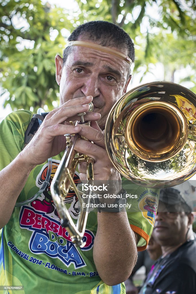 CaRnival Parade Florianópolis, Santa Catarina, Brazil - February 21, 2014: One member of the traditional band nicknamed Berbigão do Boca playing trombone, during the pre carnival celebration, that takes place in the City Center of Florianópolis Arts Culture and Entertainment Stock Photo