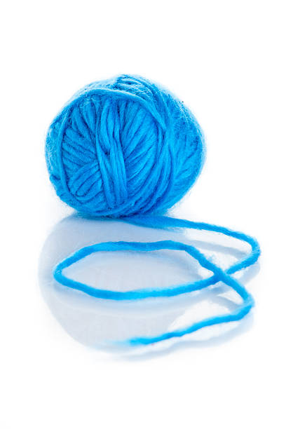 istock Blue Ball of knitting yarn on a white background 474711559