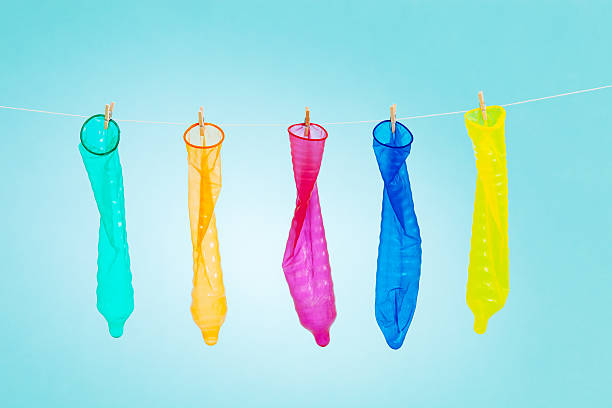 preservativi colorato - sexually transmitted disease condom five objects rubber foto e immagini stock