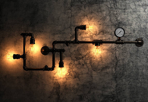 istock Light bulbs and metal pipes on the old cement wall 474715398