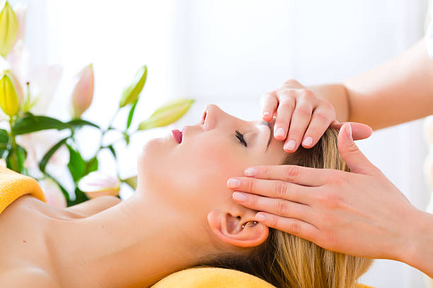 Wellness - woman receiving head or face massage in spa