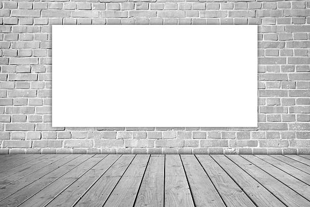 istock White blank on gray brick wall and wooden floor. 474722996