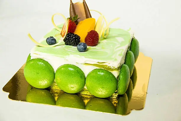 cake with top freshfruit isolated on white.
