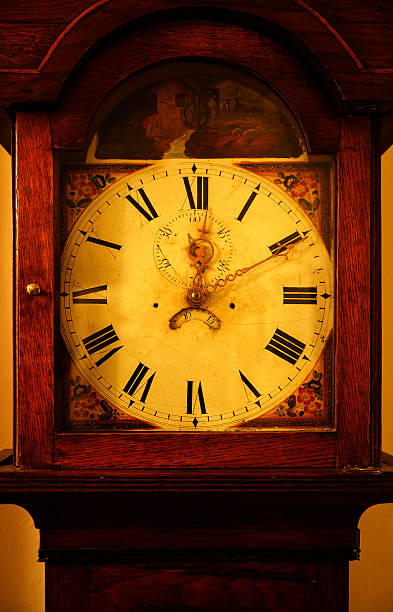 Vintage Grandfather Clock Vintage grandfather clock that has a grunge feel and reads ten minutes past twelve. steampunk fashion stock pictures, royalty-free photos & images