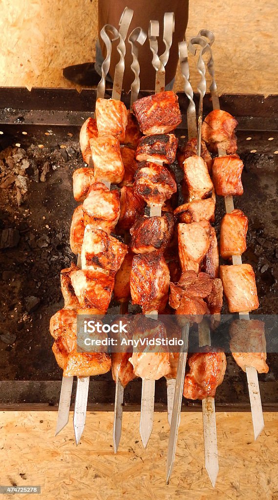 Grilled meat on skewers Grilled peaces of meat on iron skewers 2015 Stock Photo