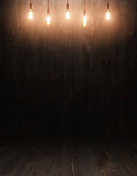 istock wooden interior room with classic Edison light bulb 474729020
