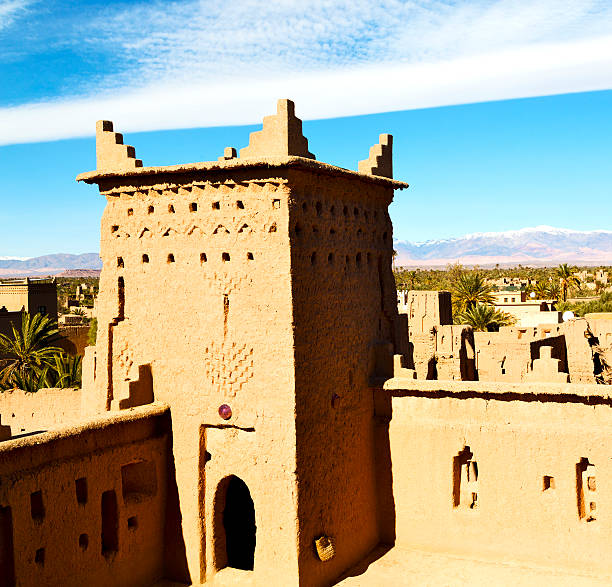 istock brown  tower  old  construction in  africa morocco and  clouds 474730088