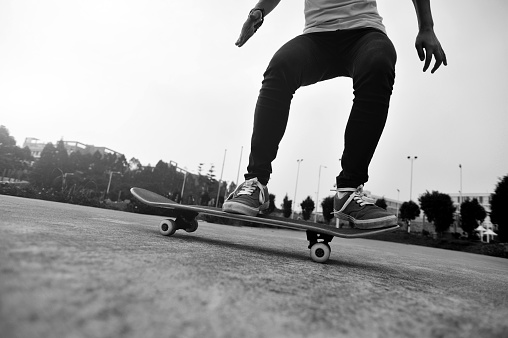 young skateboarder skateboarding outdoor