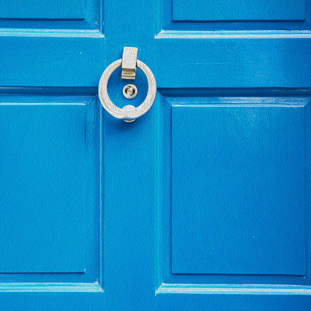 blue handle  in london antique  door  rusty  brass nail and light